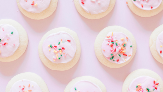 Sugar cookies on a pick background.