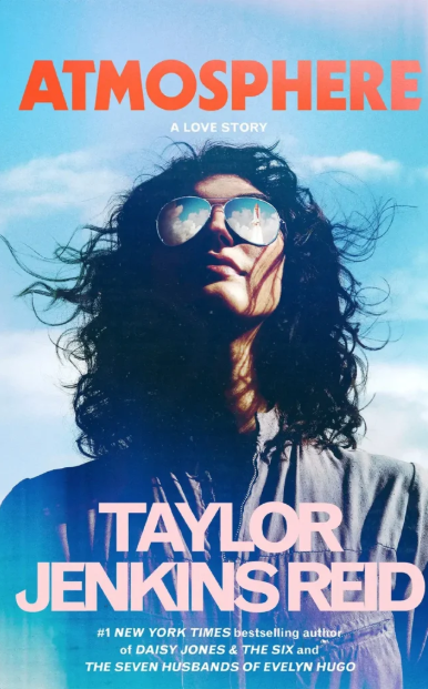A space shuttle is reflected in a woman's sunglasses on the cover of Athmosphere by Taylor Jekins Reid.