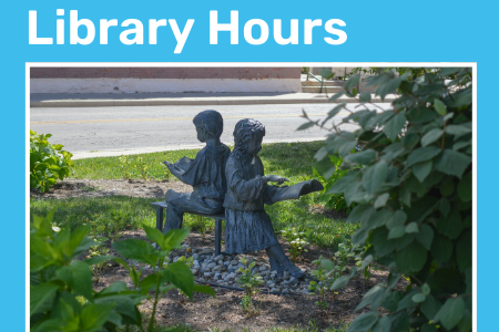 A statue of two children reading.